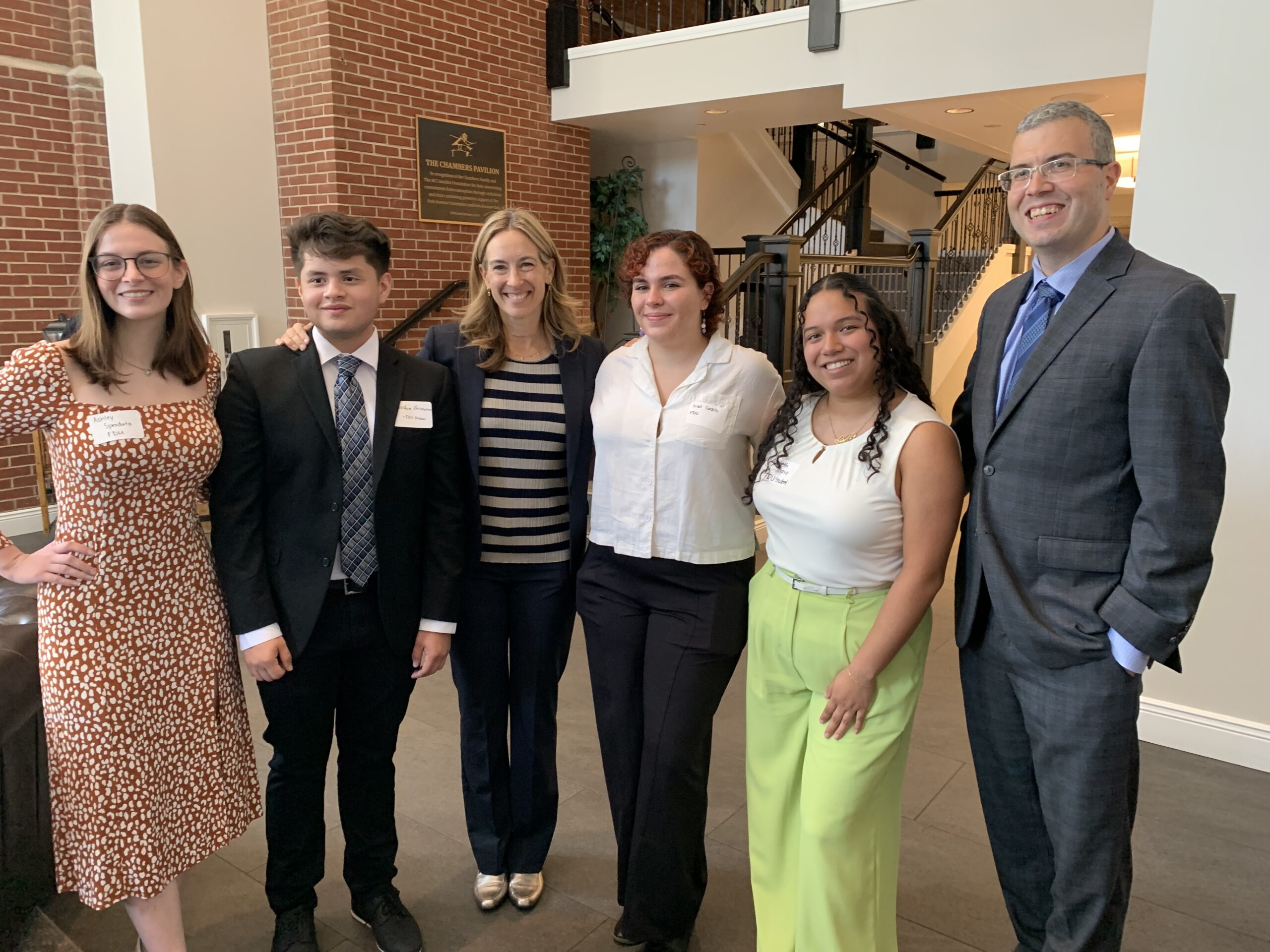 A group photo of students with U.S. Representative Mikie Sherrill and President Avaltroni.