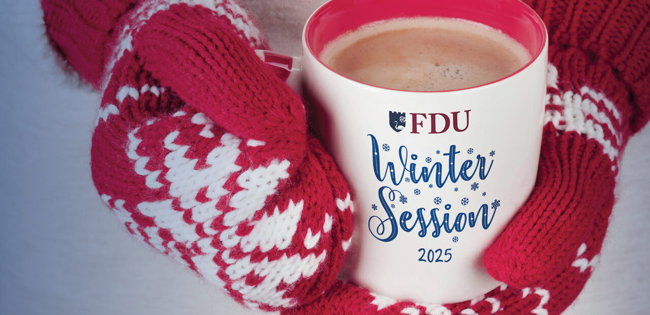 Hands in winter mittens hold a coffee mug that reads FDU Winter Session 2025.