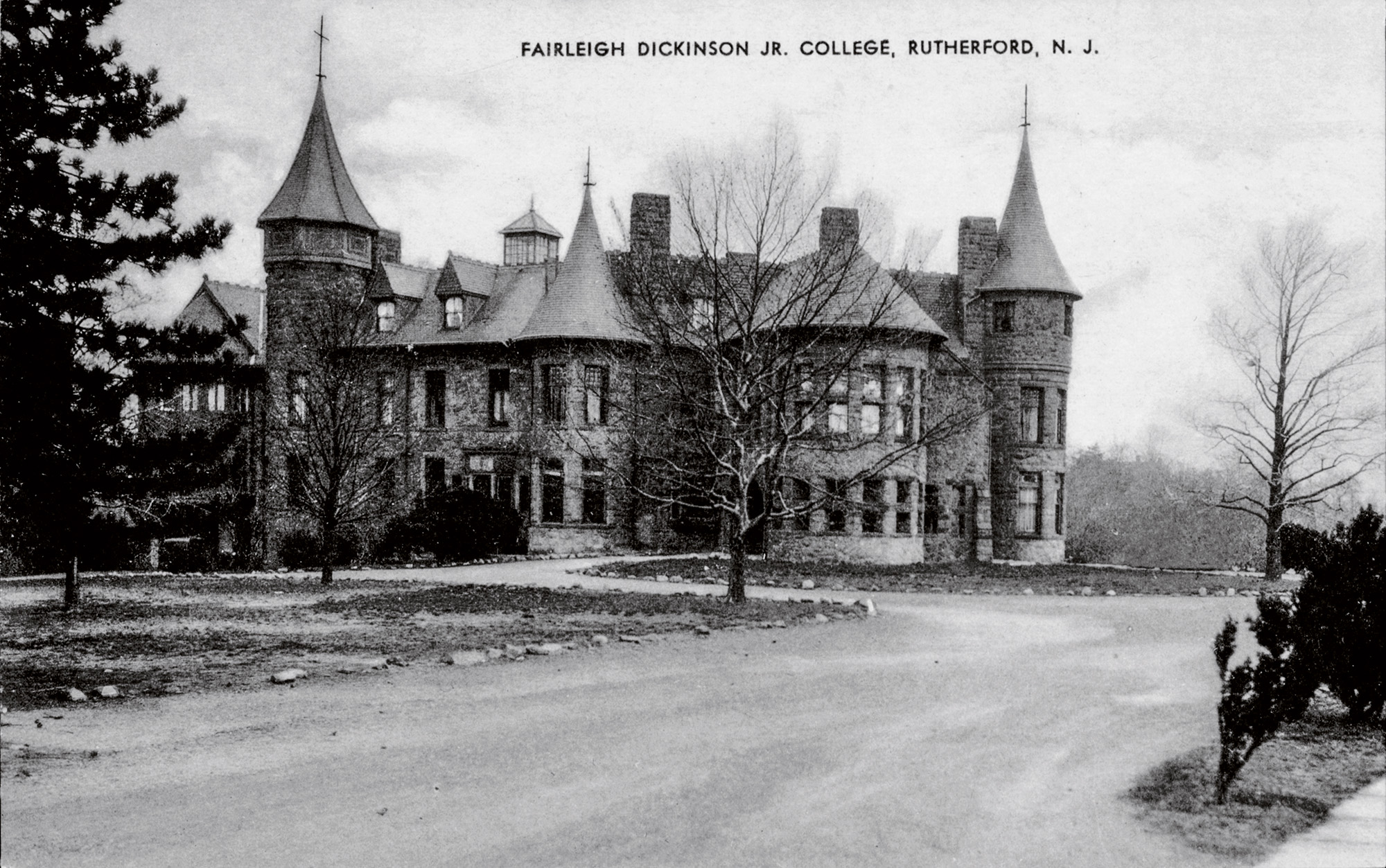 A vintage black and white postcard shows the Rutherford castle.