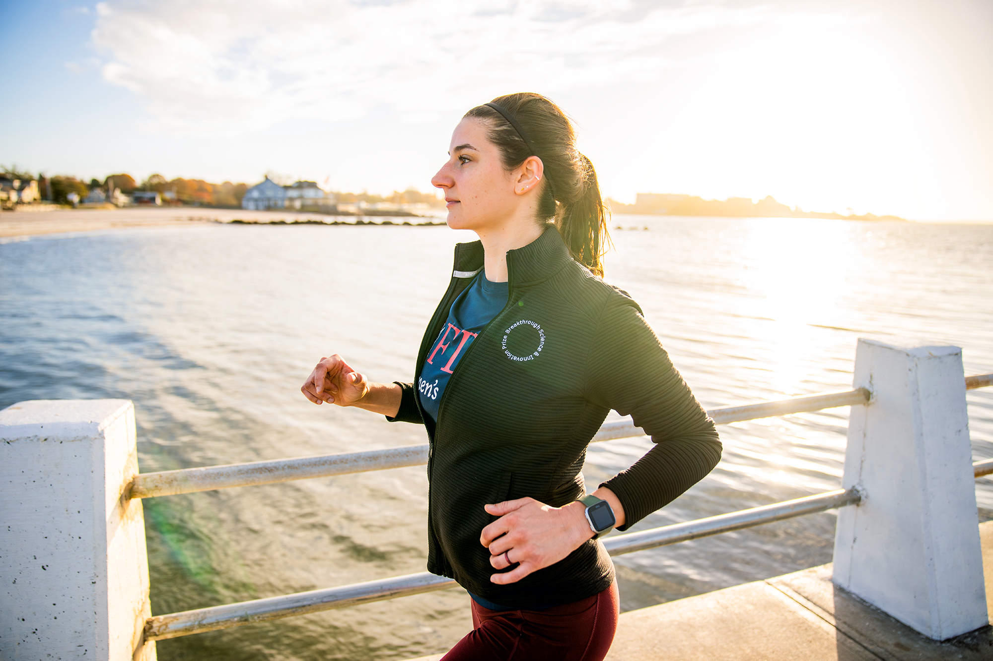 A woman wearing an FDU athletics T-shirt, hits reset with an outdoor jog.